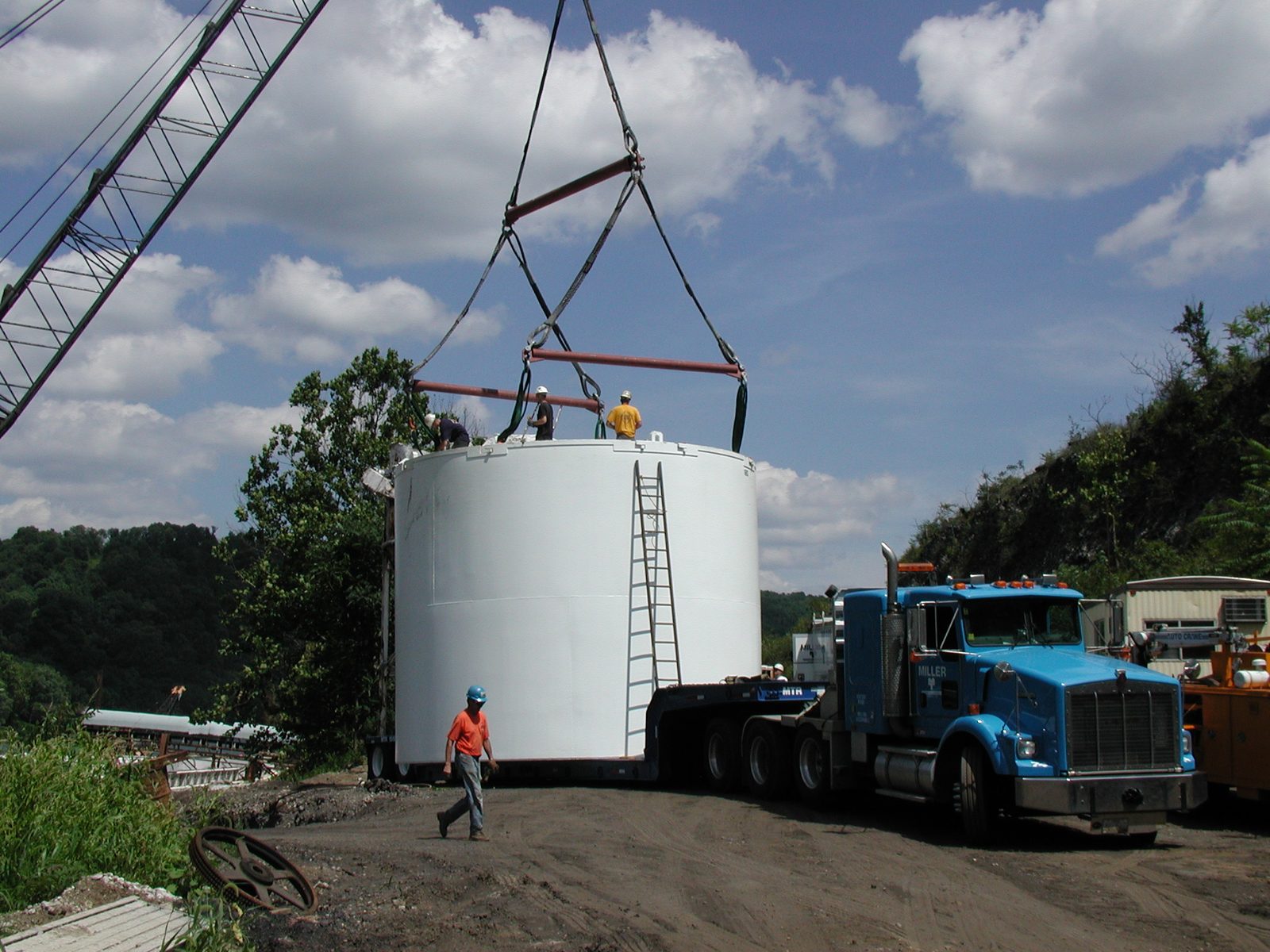 Large fabricated storage tank loaded for delivery