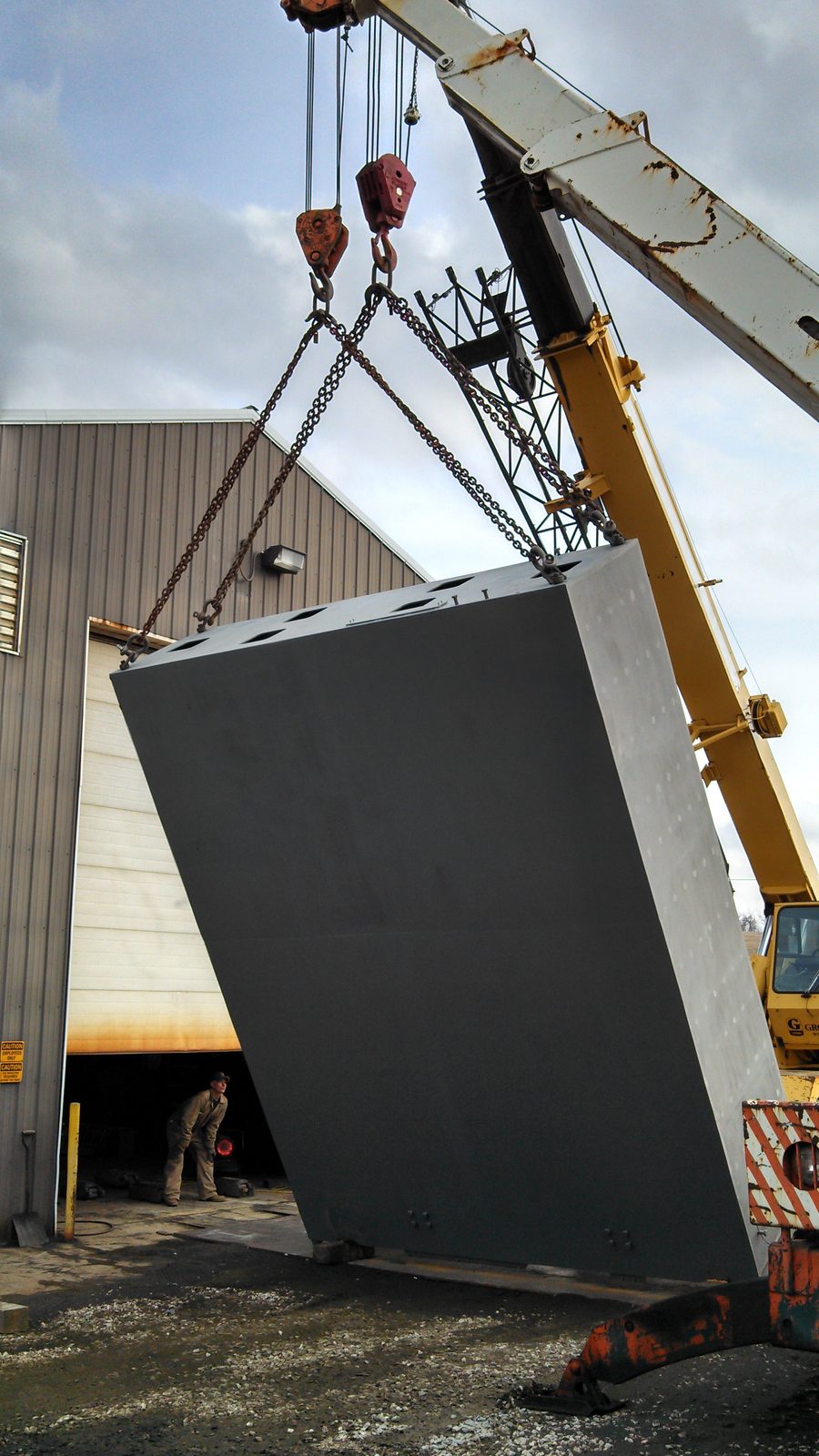 Coated steel hopper lifted for shipment